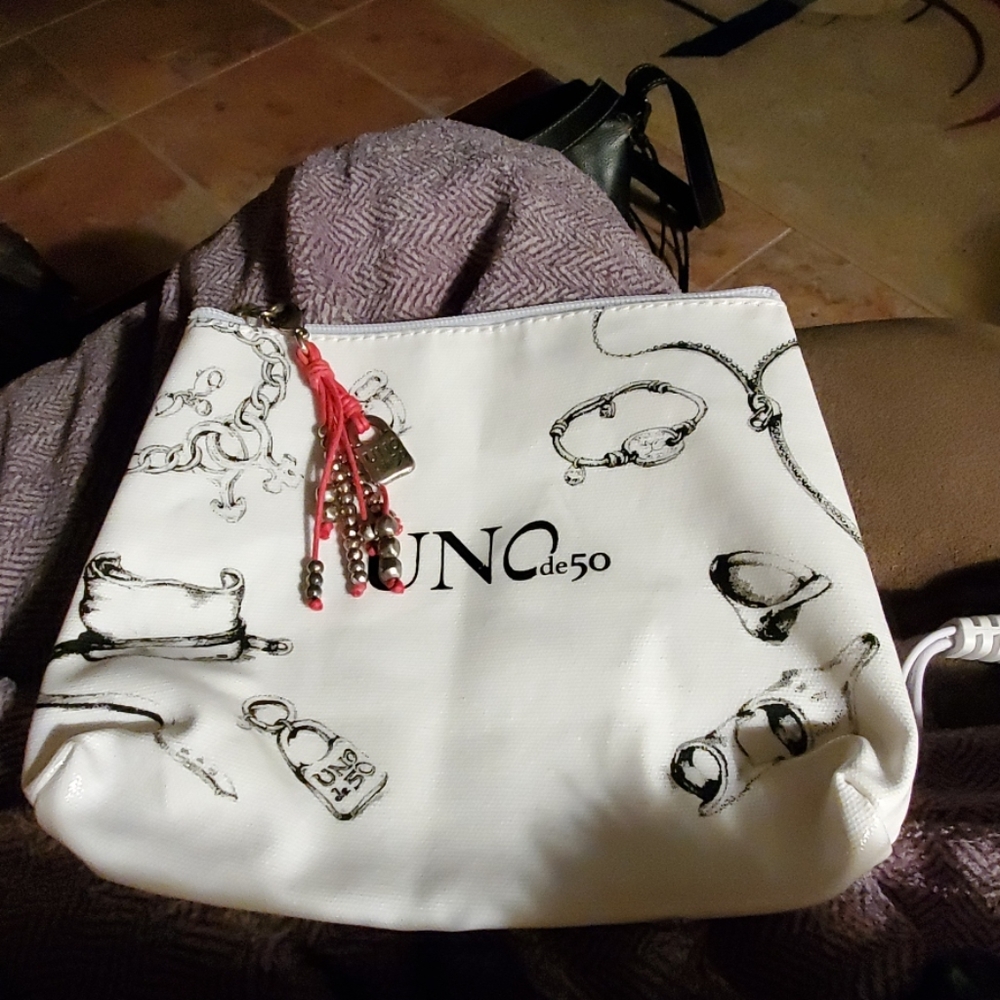 Unode50 makeup or bag from uno charms aah nobody has but, was given by uno
